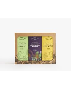 Brown box with black illustrations of plants with a big cutout displaying three boxes of Cartwright & Butler biscuits. On the left a light green box of sea salted caramel biscuits, in the middle a dark purple box of demerara shortbread rounds, on the righ