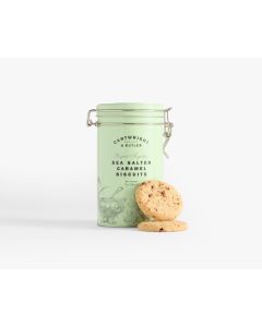 A light green tin with metal clasp of Cartwright & Butler sea salted caramel biscuits with illustrations of a pot and plants in grey, with two biscuits leaning against the tin