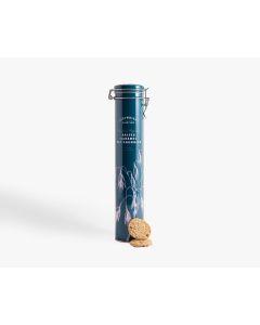 Tall dark blue tin with metal clasp of Cartwright & Butler salted caramel oat crumbles with illustrations on a plant in a light pink, in front of the tin is two biscuits 