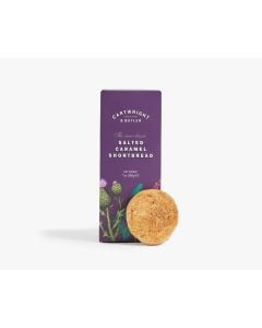 Dark purple box of Cartwright & Butler salted caramel shortbread with illustrations of different plants in green, pink, and a vibrant blue with a shortbread biscuit leaning against the box