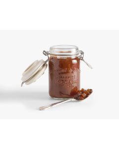 Glass jar with metal clasp and light green tag of Cartwright & Butler sweet apply chutney 