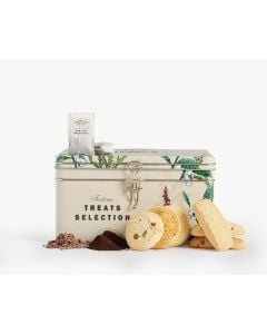 Cream tin with metal clasp of Cartwright & Butler teatime treats with colourful illustrations of different flowers and a bird in different shades of green, red, and white. There are two tea bags on top of the tin, five different biscuits leaning against t